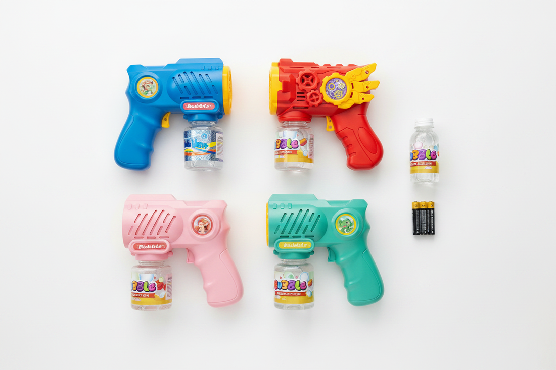 Blue, red, pink, and teal green kids bubble guns from Go Baby arranged with bubble solution refill and batteries on a white surface