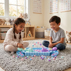 Two children playing with Frogs Subsonic Tabletop Game on a carpeted floor in a room with toys and alphabet posters on the wall.