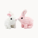 Two Plush Rabbit Jumping Toy, one white and one pink, on a white background