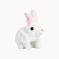 White plush rabbit toy with pink ears on a white background