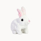 White plush rabbit toy with pink ears on a white background