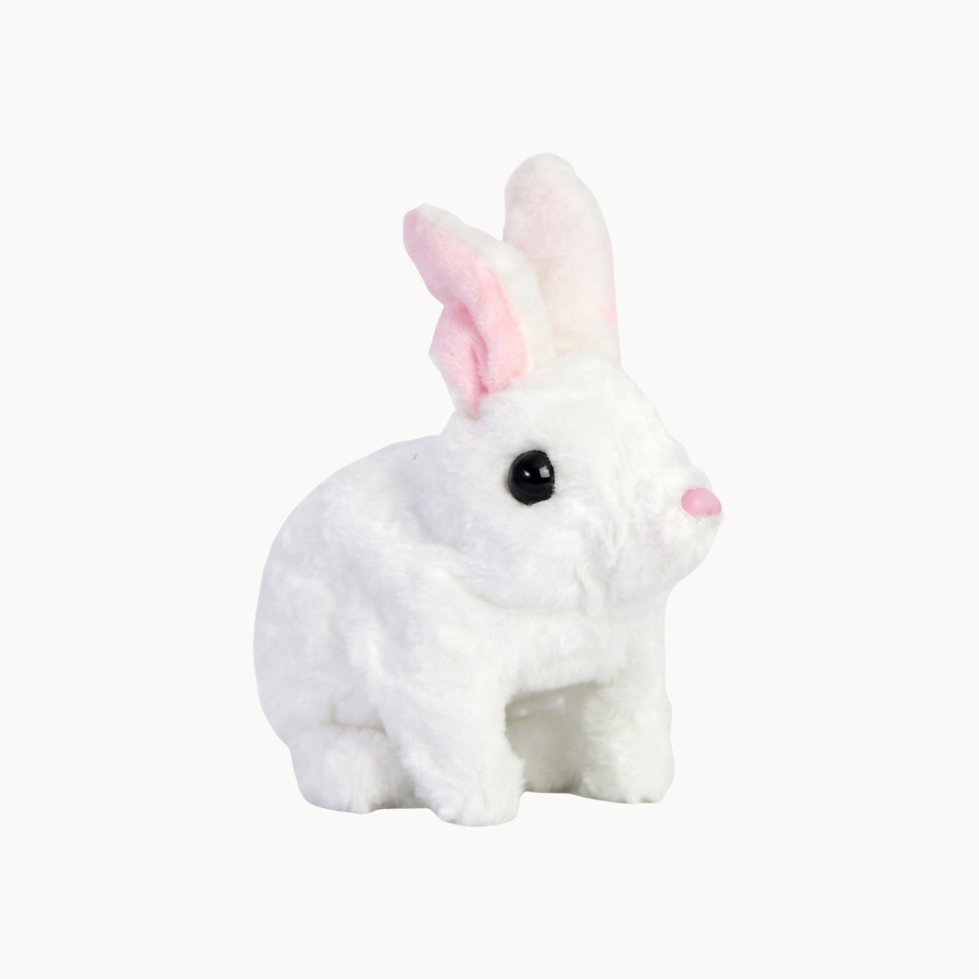 White plush rabbit toy with pink ears on a white background